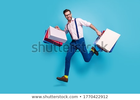 Stockfoto: Funny Man With Shopping On Sale