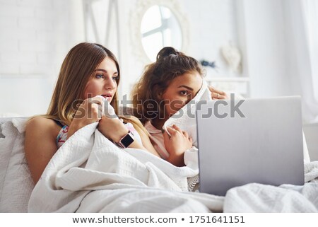Stok fotoğraf: Two Scared Girls Wearing Pajamas