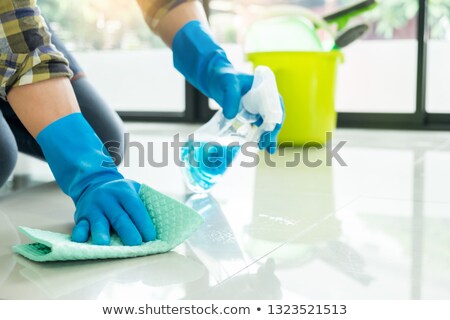 Zdjęcia stock: Man With Cloth Cleaning Floor In Home Uses Rag And Fluid In A Sp