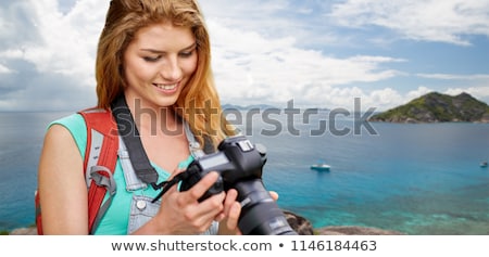 Stock photo: Woman With Backpack And Camera Over Seychelles