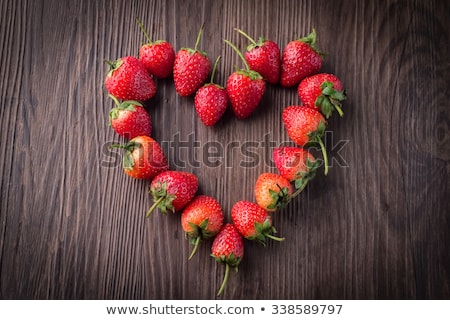 Сток-фото: Fresh Strawberries Array Heart Shape On Old Wooden Background