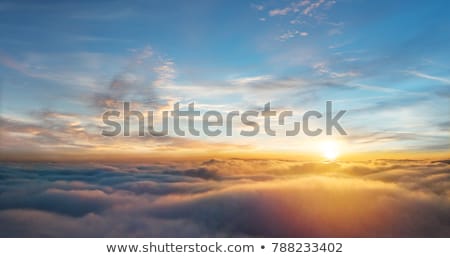 Airplane View Of Clouds Ocean And Bright Sun [[stock_photo]] © Jag_cz