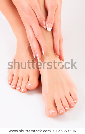 Stock photo: Well Groomed Hands On Female Feet