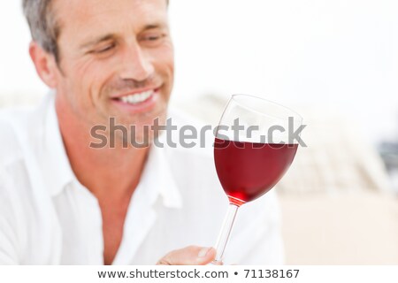 Stockfoto: Handsome Man Drinking Some Red Wine At Home
