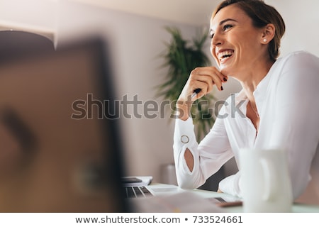 Сток-фото: Young Woman Smiling With Her Hand On Chin