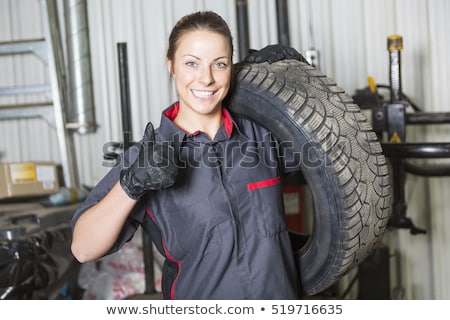 Foto stock: Mechanic Woman Working On Car In His Shop