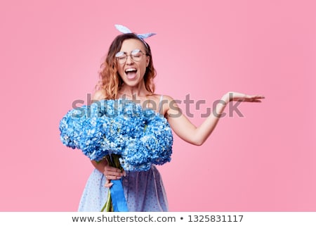 Foto stock: Attractive Young Smiling Woman With Flowers Roses Isolated