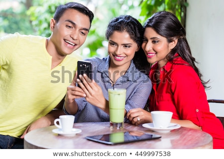 Friends Drinking Milkshakes In A Bar Stockfoto © Kzenon