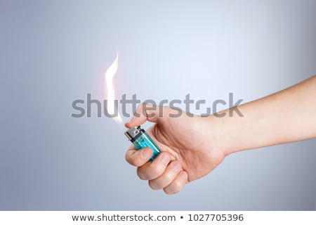 Сток-фото: Hand Holding A Lighter Set