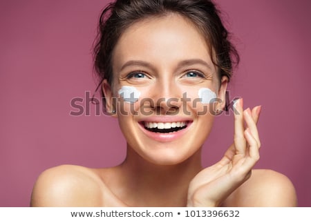 Сток-фото: Woman Applying Moisturizer Cream On Her Face