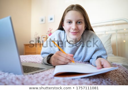 Stockfoto: Girl With Laptop On Bed