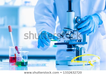 Stockfoto: Doctor Hands And Microscope