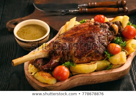 Stockfoto: Roasted Lamb Leg With Potatogarlic And Sauce