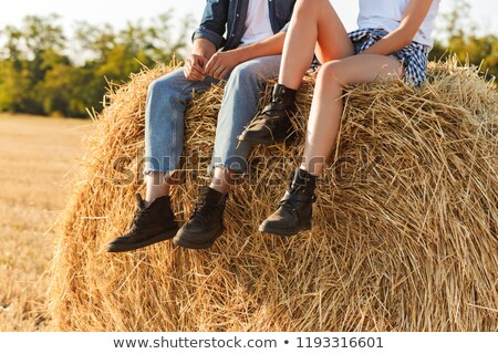 Stock fotó: Cropped Photo Of Lovely Man And Woman Sitting On Big Haystack In