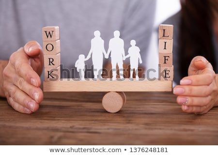 Stockfoto: Couple Protecting Work And Life Balance On Seesaw