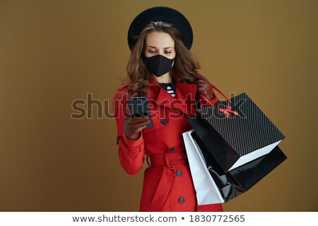 Stock photo: Stylish Woman With Golden Mask And Gift