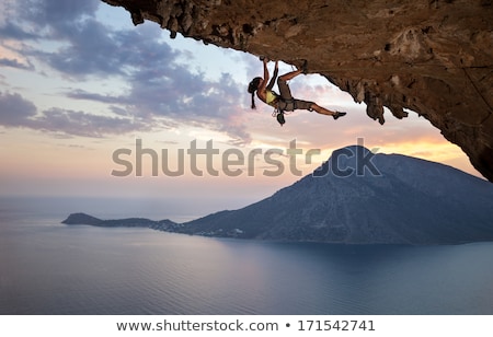 Stock photo: Woman Rock Climbing