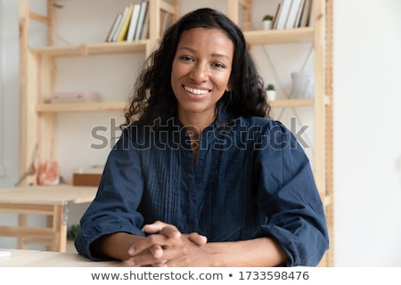 Stockfoto: Close Up Of Mixed Race Businesswoman Sitting And Looking At The Digital Tablet In The Auditorium