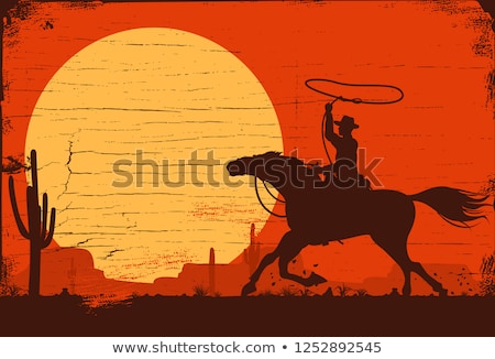 ストックフォト: Rodeo Cowboy At Sunset