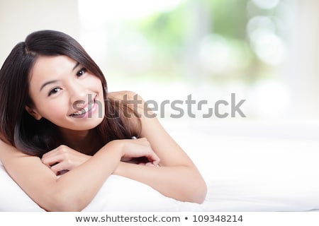 Сток-фото: Close Up Of Young Woman Lying In Bed At Home