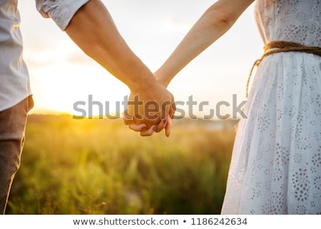 Imagine de stoc: Happy Love Couple Holding Hands
