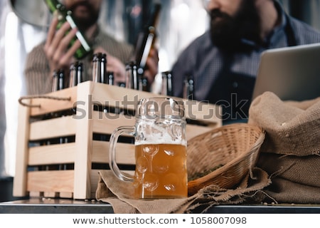 Stockfoto: Man With Bottles In Box At Craft Beer Brewery