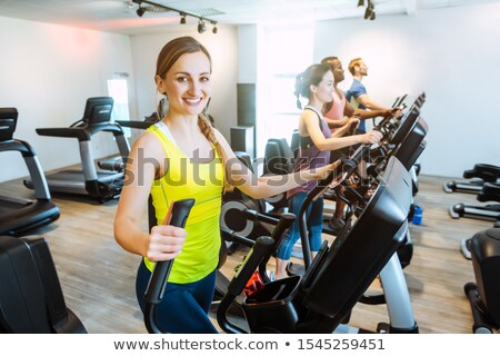 ストックフォト: Caucasian Woman And Her Friends Doing Step Training In Gym