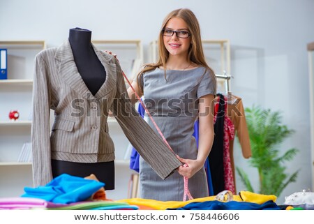 ストックフォト: The Woman Tailor Working On New Dress Designs