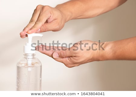 Stockfoto: Hand Using Alcohol Rub Gel