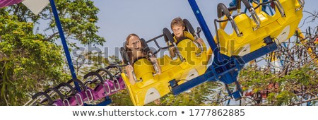 Zdjęcia stock: Mother And Son Having A Ride In The Bumper Car At The Amusement Park Banner Long Format