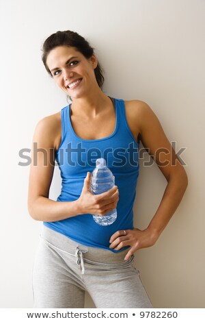 Pretty Young Woman In Workout Attire Imagine de stoc © iofoto