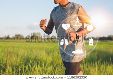 Foto stock: Runner Looking At Sport Watch