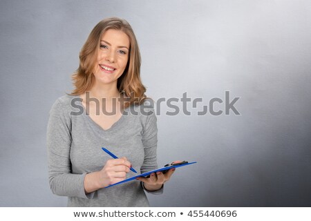 Stock fotó: Smiling Secretary Holding Note Book