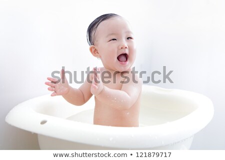 Foto stock: Happy Excited Baby Taking A Bath