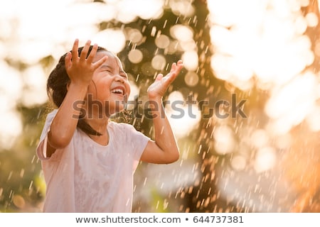 Stock fotó: Girls Having Fun In The Rain