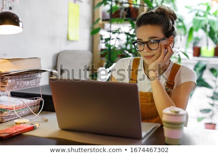 ストックフォト: Young Woman Working On Computer In Office