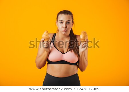 Stock foto: Image Of Amusing Chubby Woman In Tracksuit Holding Two Croissant