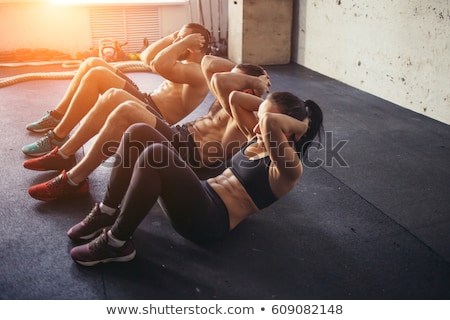 Zdjęcia stock: Attractive Woman Athlete Performing Exercise For Abdominal Muscl