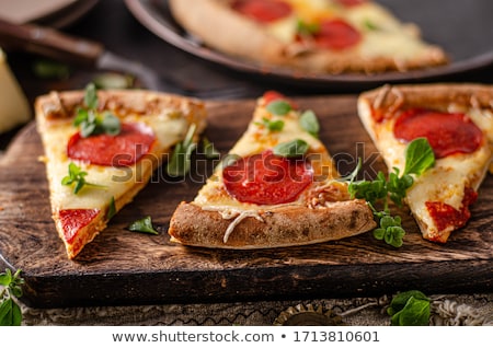 Foto stock: Homemade Salami Pizza With Cheese Corners