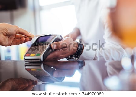 Stockfoto: Woman Pay With Credit Card In Bar