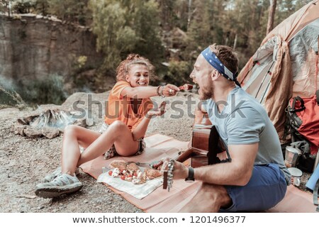 Zdjęcia stock: Young Couple On A Cliff Playing Guitar