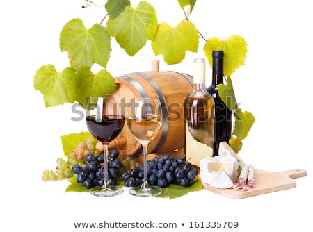 Stock fotó: A Bottle Of White Wine Grape Leaves Around It
