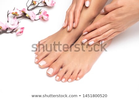 Stock photo: Women Feets And Flowers Pedicure Tbackground