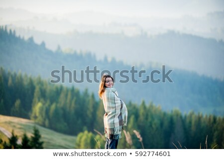 ストックフォト: Smiling Woman With Backpack Over Mountains