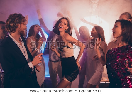 Foto stock: Woman With Glass Of Champagne At Night Club