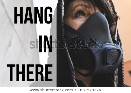 Foto stock: Woman Surviving Pandemic With A Gas Mask On The Street