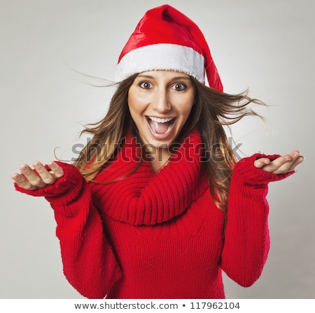 [[stock_photo]]: Young Beautiful Brunette Woman Wearing Santas Hat