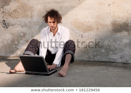 Zdjęcia stock: Man Writing On The Floor