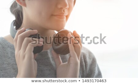 [[stock_photo]]: Girl Holding Headphones