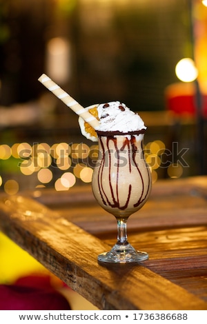 Foto stock: Sweet Waffle Dessert With Whipped Cream And Brown Chocolate Icing With The Decoration Of Cookies And